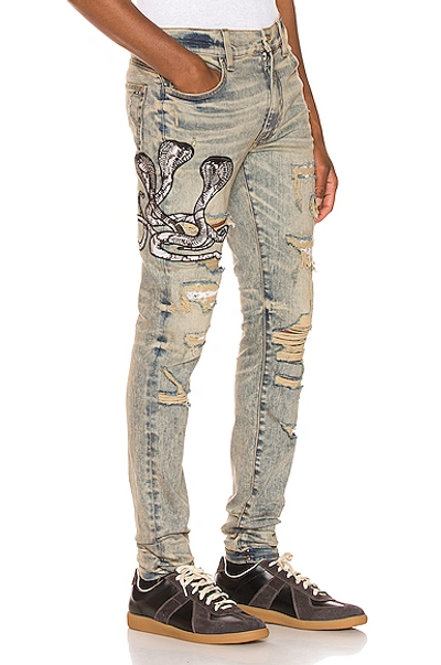 Shop Amiri Snake Patch Jean