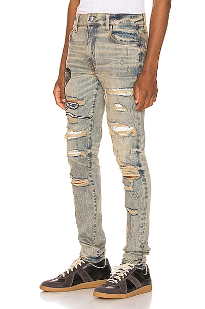 Amiri Mx1 Skinny-fit Appliquéd Faux Snake-panelled Distressed Stretch-denim  Jeans In Dindrtindig | ModeSens