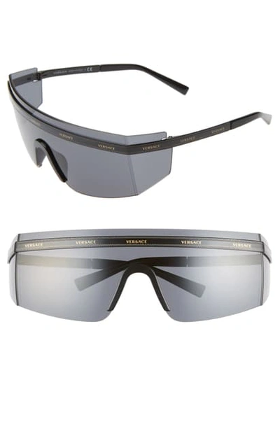 Shop Versace 65mm Shield Wrap Sunglasses In Black/ Gold/ Black Solid