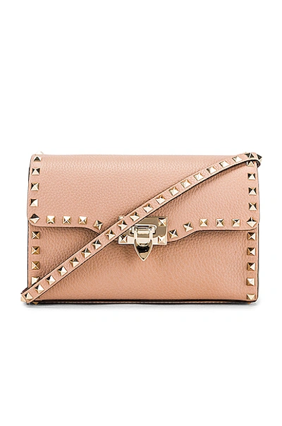 Shop Valentino Rockstud Small Shoulder Bag In Pink In Poudre