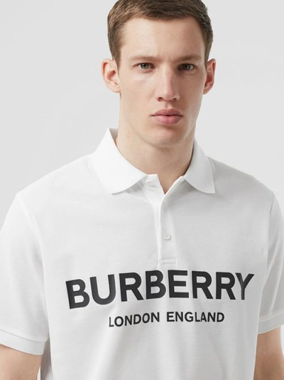Shop Burberry Logo Print Cotton Piqué Polo Shirt In White