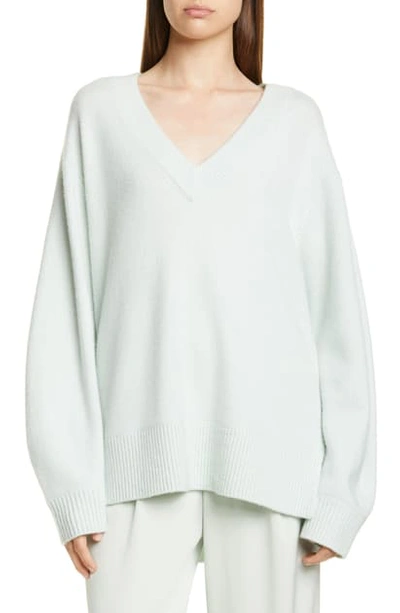 Shop Vince V-neck Cashmere Tunic Sweater In Aloe