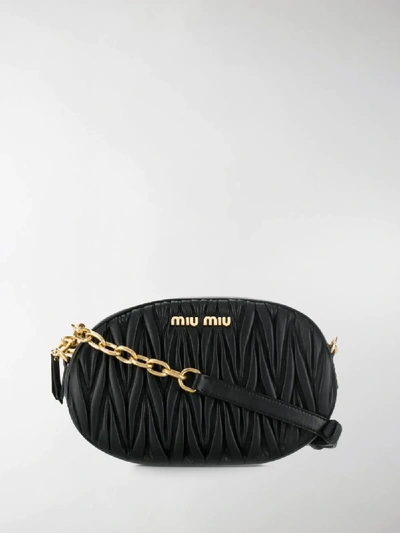 Shop Miu Miu Matelassé Logo Crossbody Bag In Black