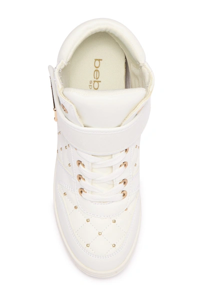 Shop Bebe Studded Hi-top Wedge Sneaker In White Faux