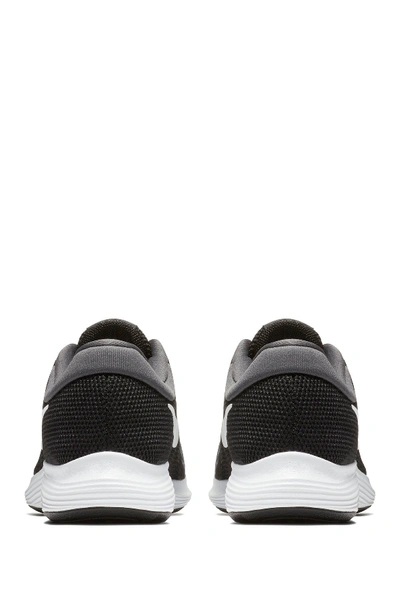 Shop Nike Revolution 4 Running Sneaker In Black/white