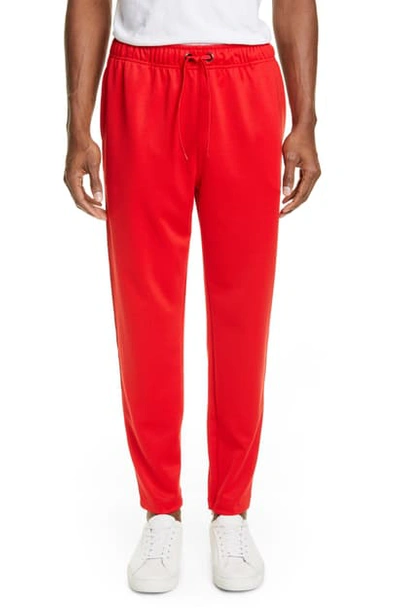 Shop Burberry Sorrento Icon Stripe Slim Fit Track Pants In Bright Red