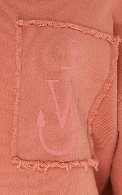 Shop Jw Anderson Frayed Embroidered Cotton-jersey Sweatshirt In Pink