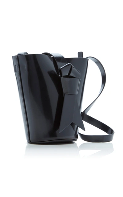 Shop Acne Studios Musubi Knotted Patent-leather Shoulder Bag In Black