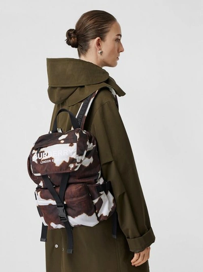 Shop Burberry Cow Print Nylon Backpack In Mahogany