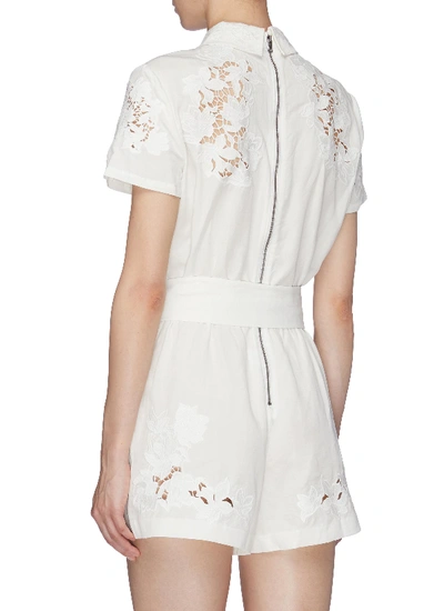 Shop Alice And Olivia 'lanna' Belted Guipure Lace Panel Rompers In White