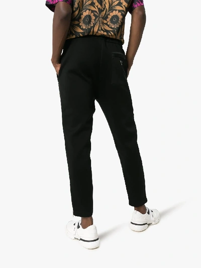 Shop Prada Zip Cuff Straight Leg Trousers In 101 - Black