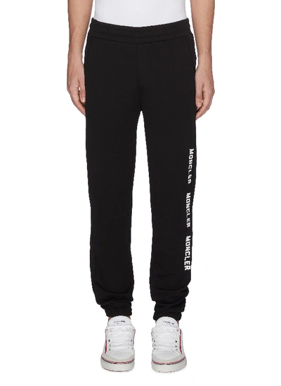 Shop Moncler Logo Stripe Outseam Jogging Pants In Black