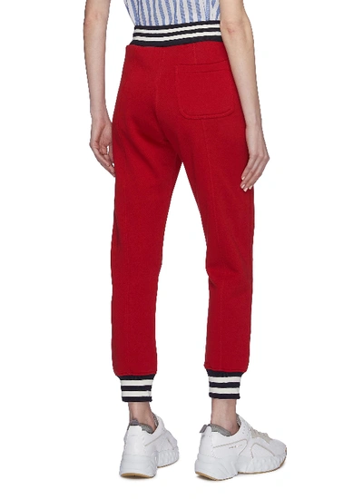 Shop Acne Studios Slogan Print Sweatpants In Red