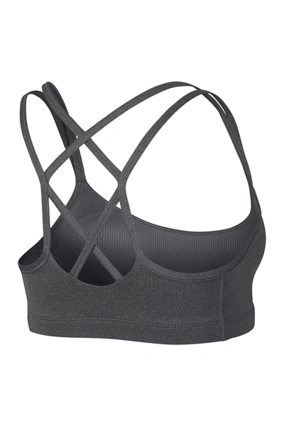 Shop Nike Strappy Dri-fit Sports Bra In Carb H/black
