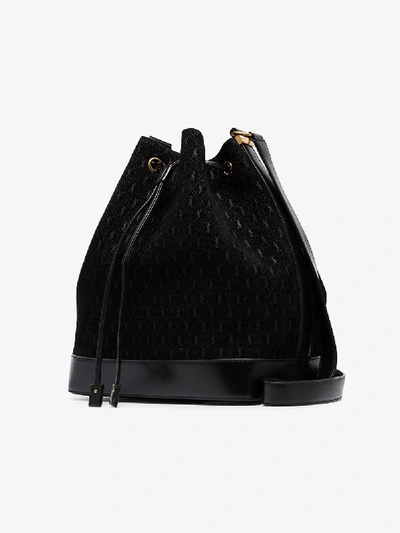 Shop Saint Laurent Black Suede Monogram Bucket Bag