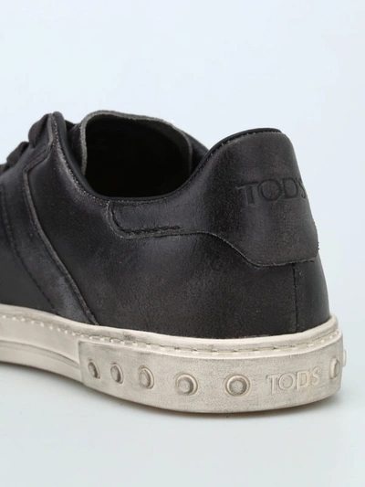 Shop Tod's Used Effect Leather Low Top Sneakers In Black