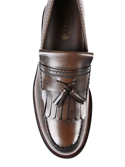 Shop Tod's Glossy Faded Leather Loafers In Dark Brown