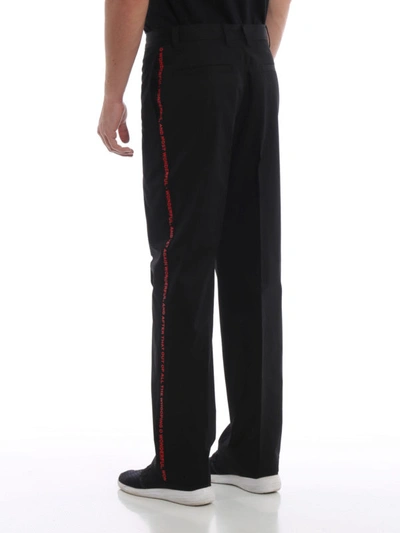 Shop Burberry Contrasting Quote Detail Cotton Trousers In Black