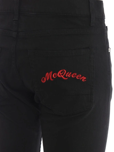 Shop Alexander Mcqueen Total Black Jeans With Red Embroidery