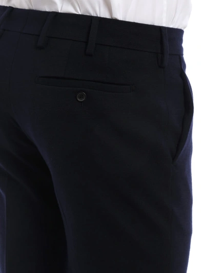 Shop Prada Wool Stitched Jersey Trousers In Dark Blue