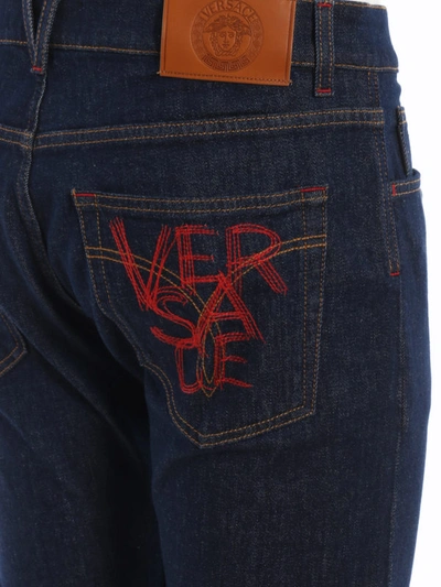Shop Versace Denim Jeans With Logo Embroidery In Dark Wash