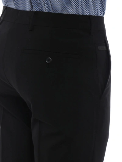 Shop Prada Bi-stretch Wool Tapered Trousers In Black
