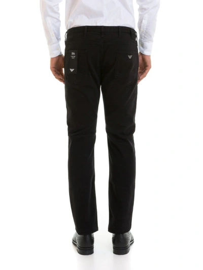 Shop Emporio Armani J06 Slim Fit Jeans In Black