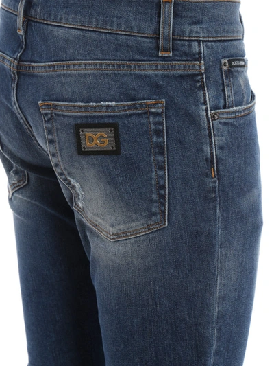 Shop Dolce & Gabbana Logo Plaque Scraped Skinny Jeans In Medium Wash