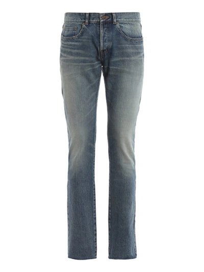 Shop Saint Laurent Bandana Detailed Raw Edge Slim Jeans In Medium Wash