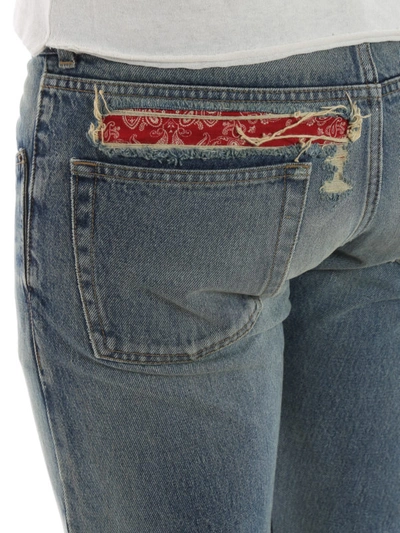 Shop Saint Laurent Bandana Detailed Raw Edge Slim Jeans In Medium Wash