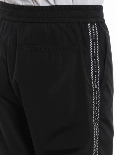 Shop Versace Logo Bands Technical Fabric Track Pants In Black