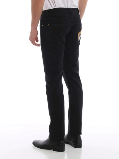 Shop Versace Rear Crest Patch Black Jeans