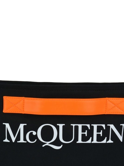 Shop Alexander Mcqueen Logo Print Clutch With Contrasting Handle In Black