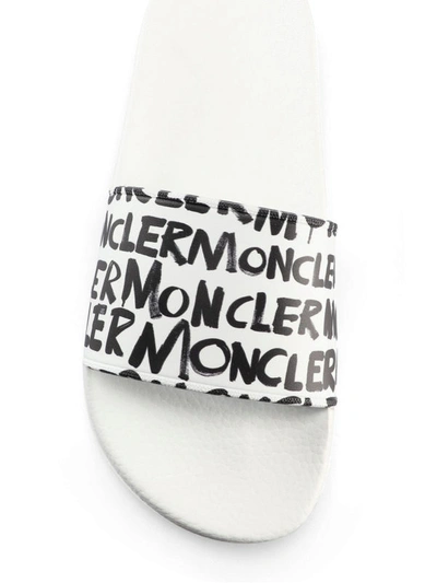 Shop Moncler White Jeanne Graffiti Style Logo Pool Slides