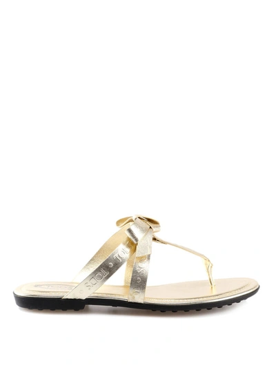 Shop Tod's Bow Detailed Metallic Thong Sandals In Gold