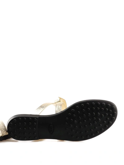 Shop Tod's Bow Detailed Metallic Thong Sandals In Gold