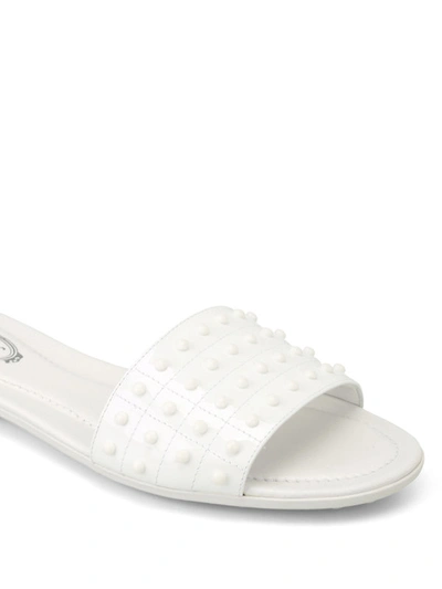 Shop Tod's Patent Leather Pebbled Slippers In White