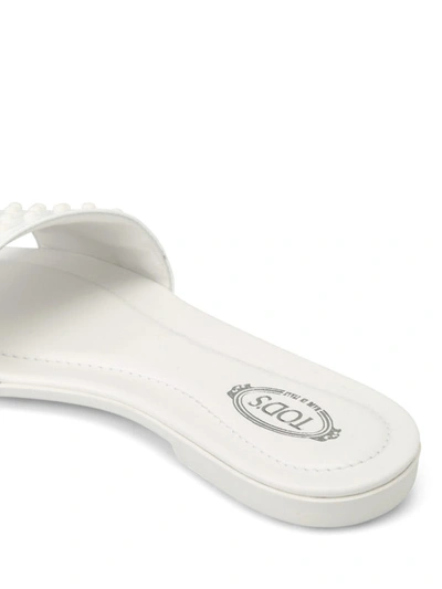 Shop Tod's Patent Leather Pebbled Slippers In White