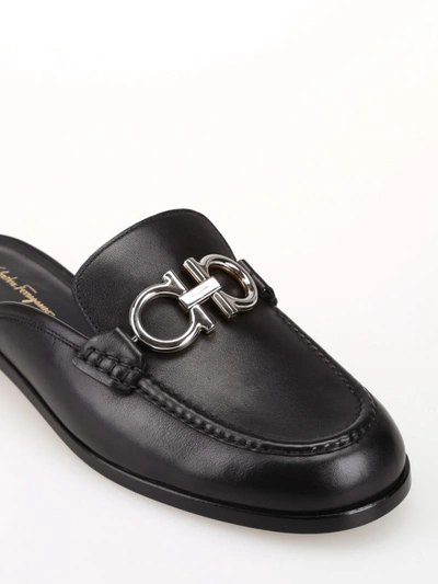 Shop Ferragamo Viggio Black And Gold Logo Leather Mules