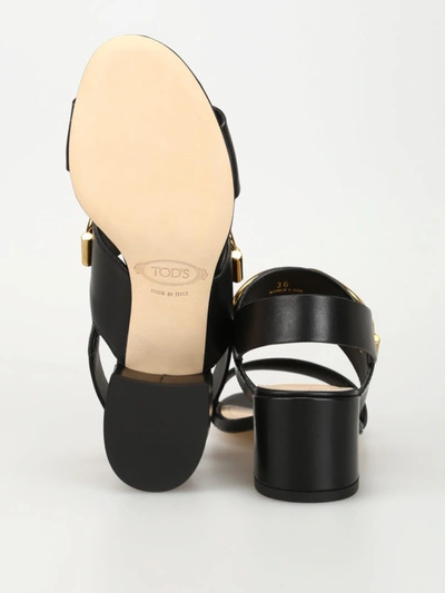 Shop Tod's Black Leather Sandals With Gold-tone T-rings