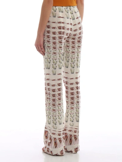Shop Prada Flower Print Silk Crepe De Chine Trousers In Multicolour