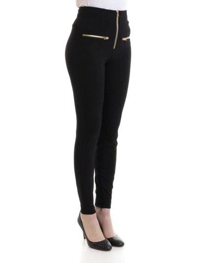 Shop Versace Stretch Tight Pants With Gold-tone Zippers In Black