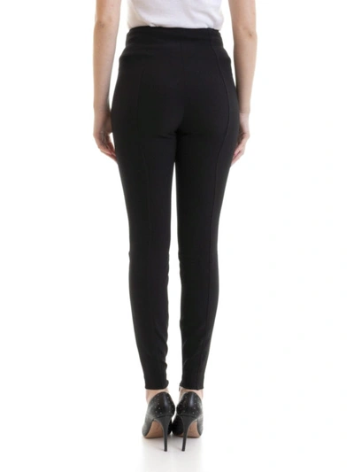 Shop Versace Stretch Tight Pants With Gold-tone Zippers In Black