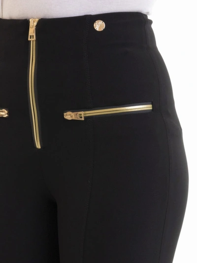 Shop Versace Stretch Tight Pants With Gold-tone Zippers In Black