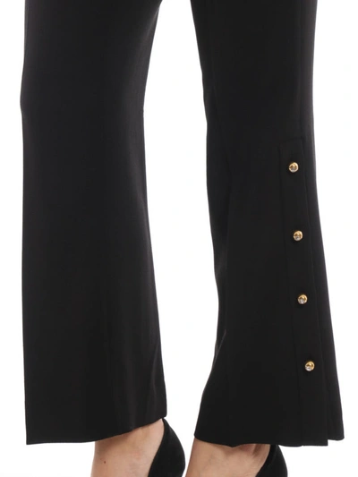 Shop Prada Flared Trousers With Gold Tone Buttons In Black