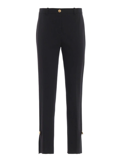 Shop Versace Wool Blend Gold-tone Brooch Trousers In Black