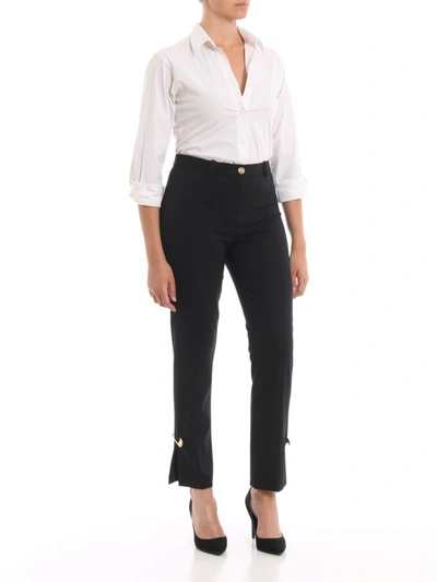 Shop Versace Wool Blend Gold-tone Brooch Trousers In Black