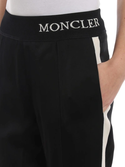 Shop Moncler Contrasting Stripe Tracksuit Bottoms In Black