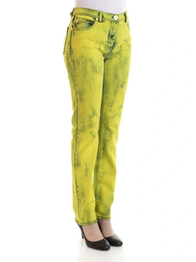 Shop Versace Fluo Wash Jeans In Yellow