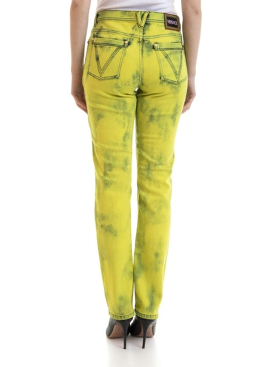 Shop Versace Fluo Wash Jeans In Yellow